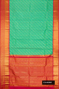 Sea Green Dual Tone Kanchipuram Silk Saree with Zari Brocade on the body and Zari Border.  displayed on a mannequin